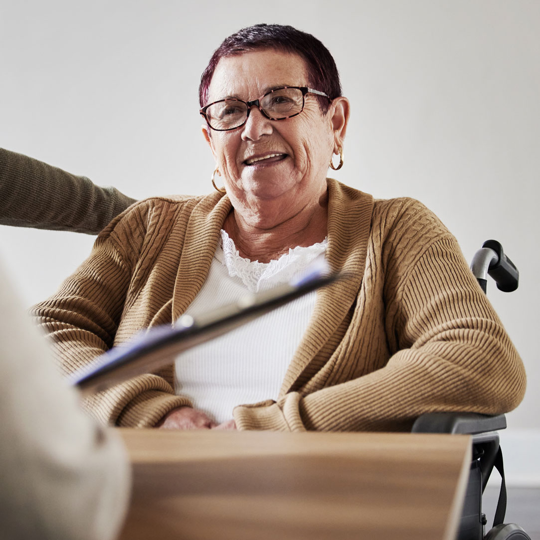 Person with short hair in a wheelchair